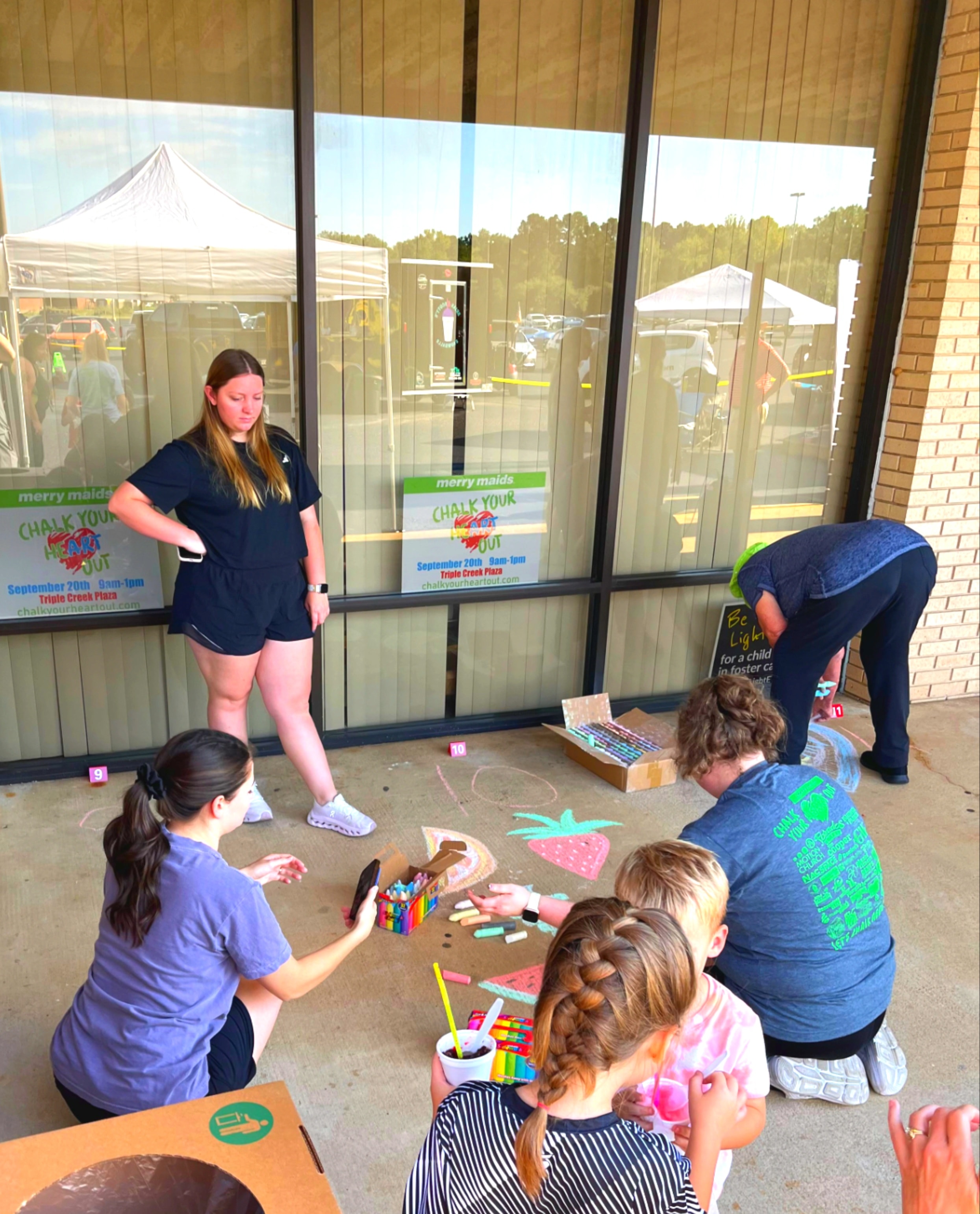 East Texas community chalk art display at Triple Creek Plaza Longview
